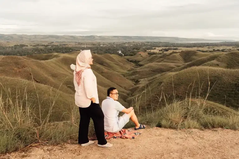 Travellers overlooking the dry-season hills of Tanau, East Sumba