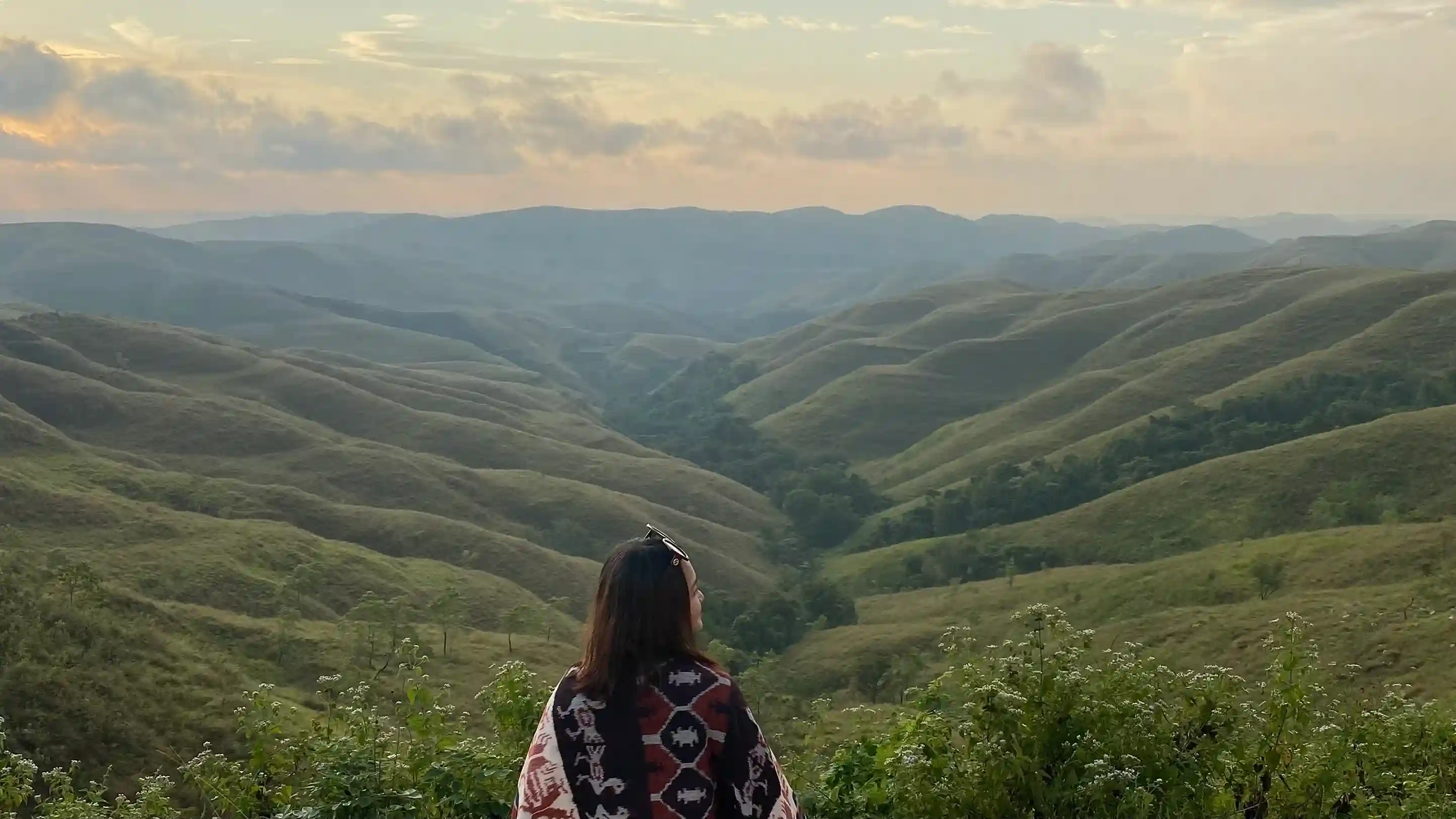Traveller looking over the Wairinding Hills, East Sumba
