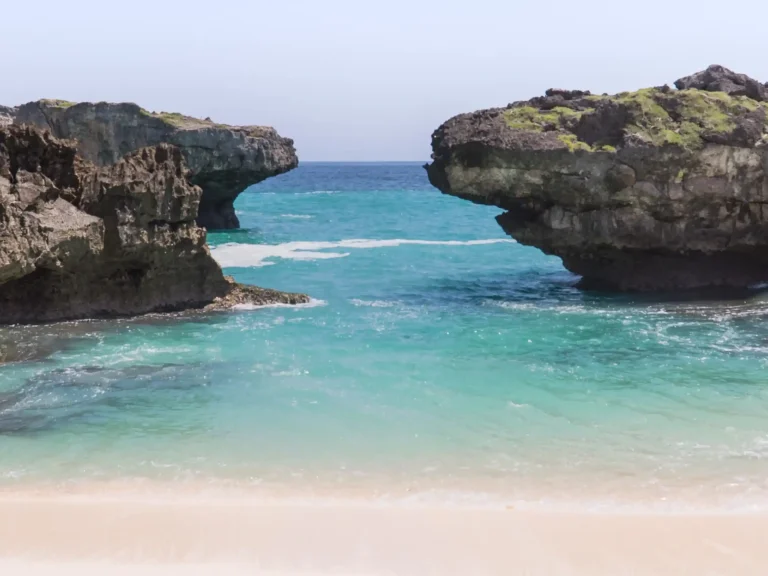 Turquoise cove between the rock cliffs of Mandorak Beach, Southwest Sumba