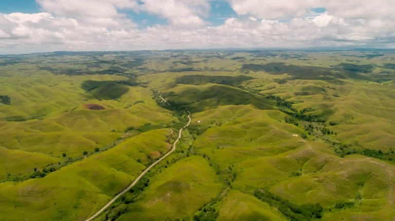 Aerial view of the open green hills of Tanau, East Sumba